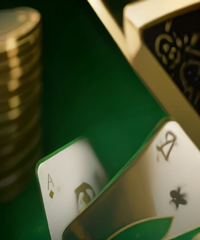 Gold chips stacked on an emerald card table